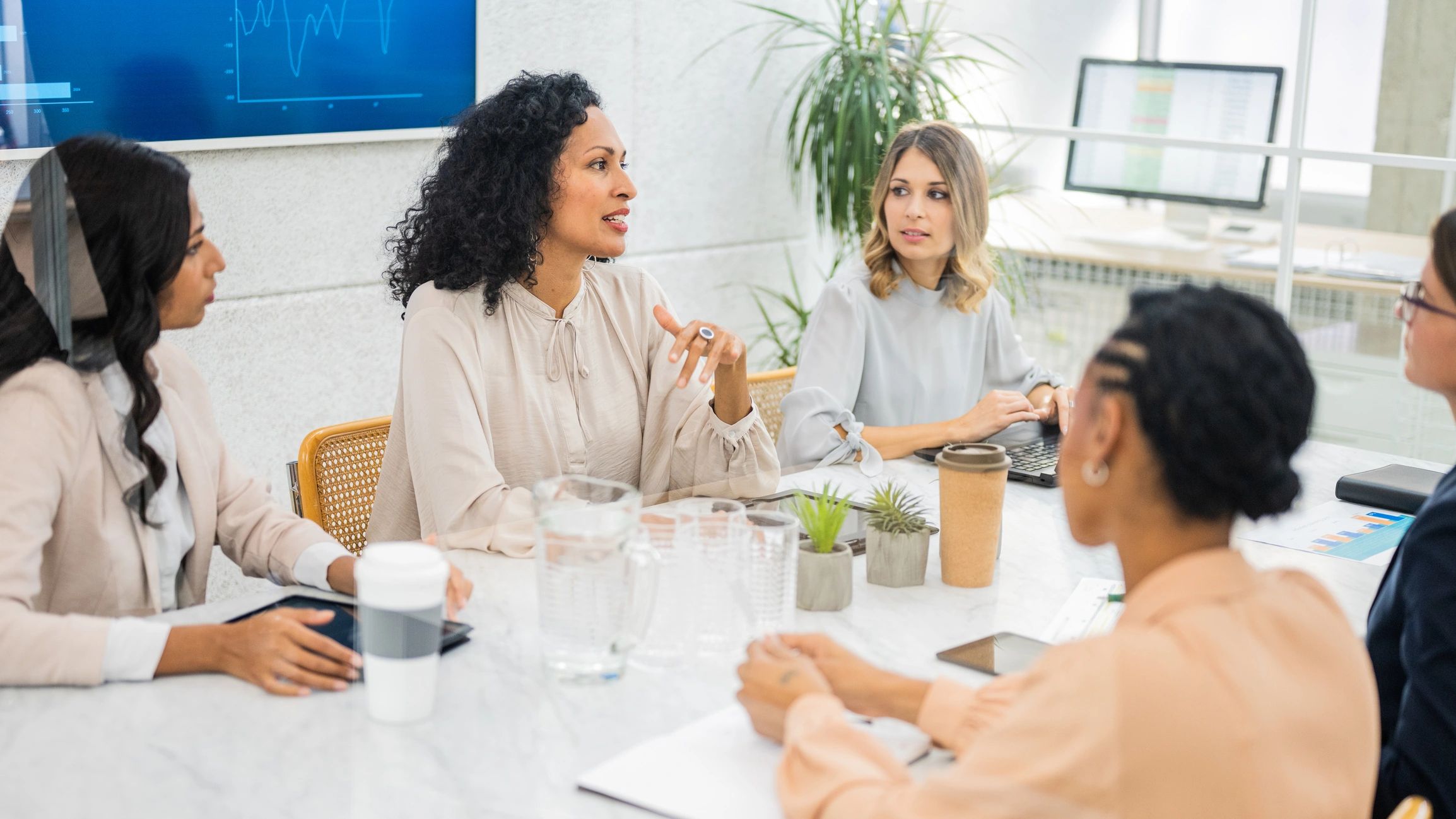 Advisors reviewing strategy during an executive meeting