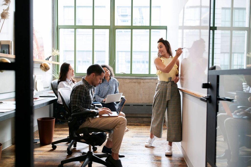 Team reviewing cyber risk data together in a modern office
